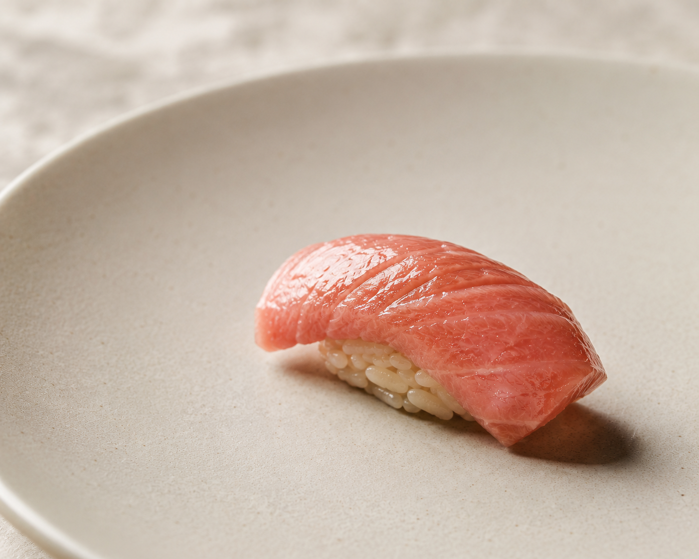Otoro nigiri on a matte ceramic plate